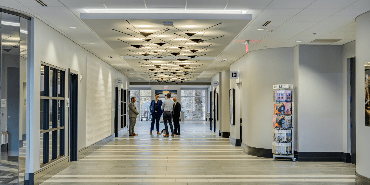 Chantilly Air staff talking to FBO customers in the hallway of Chantilly's brand new Jet Center facility.