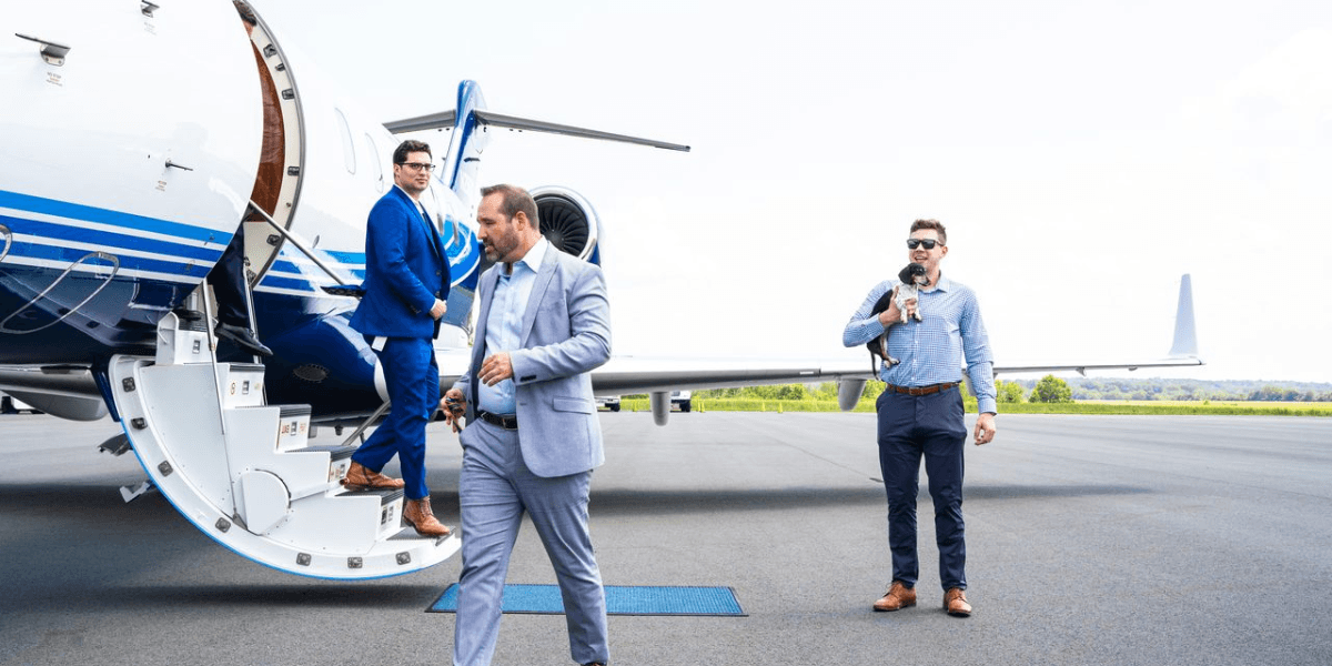 Private jet passengers disembarking at Chantilly Air FBO near Washington DC at Manassas Regional Airport (KHEF).