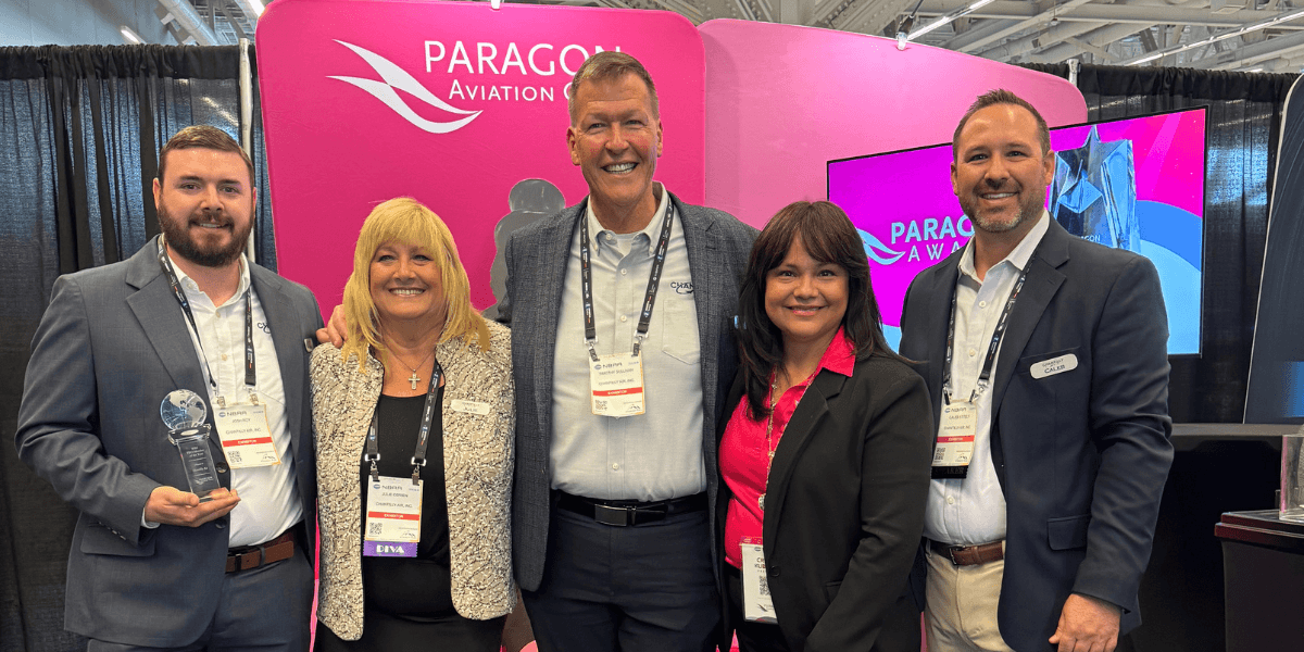 Chantilly Air team receiving Paragon Aviation Group 2025 FBO Member of the Year Award at aviation industry event