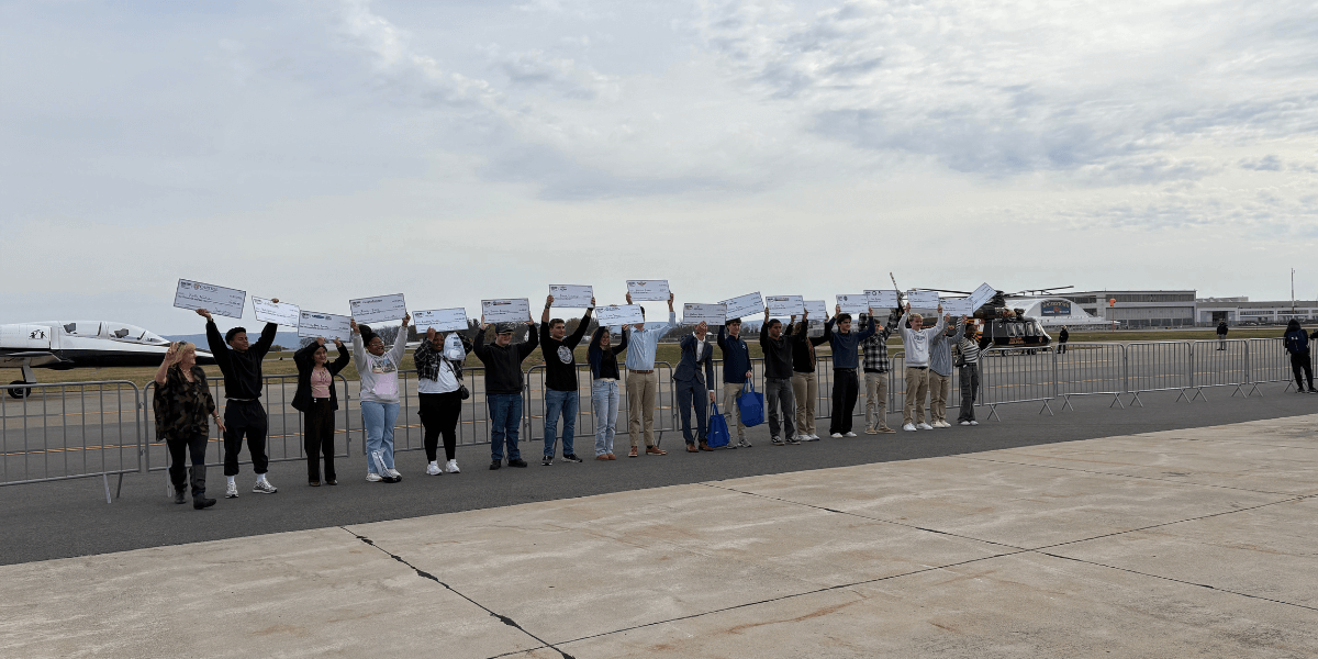 Scholarship recipients celebrate at the 19th Annual Aviation Education and Career Expo hosted by Chantilly Air, holding $196,635 in aviation and aerospace scholarships.