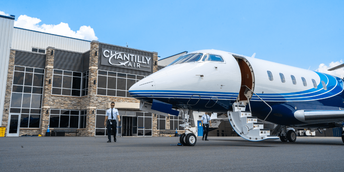 Chantilly Air Jet Center at Manassas Regional Airport with private jet on ramp, showcasing full-service FBO and Avfuel partnership in Washington DC region