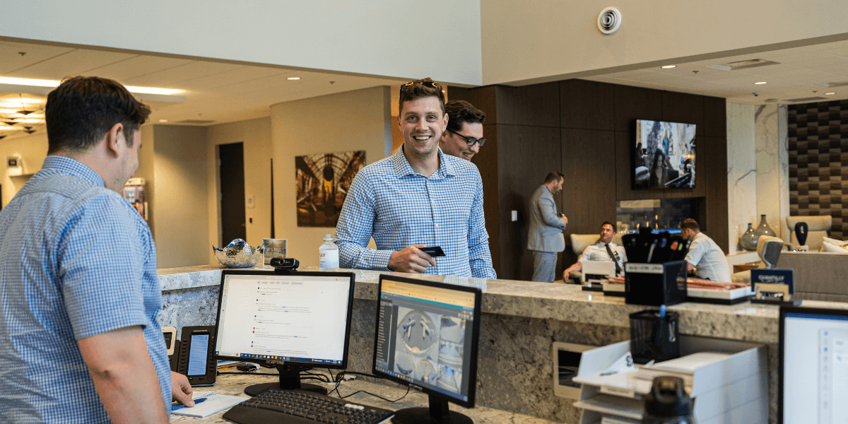 Chantilly Air receptionist speaking to client at front desk