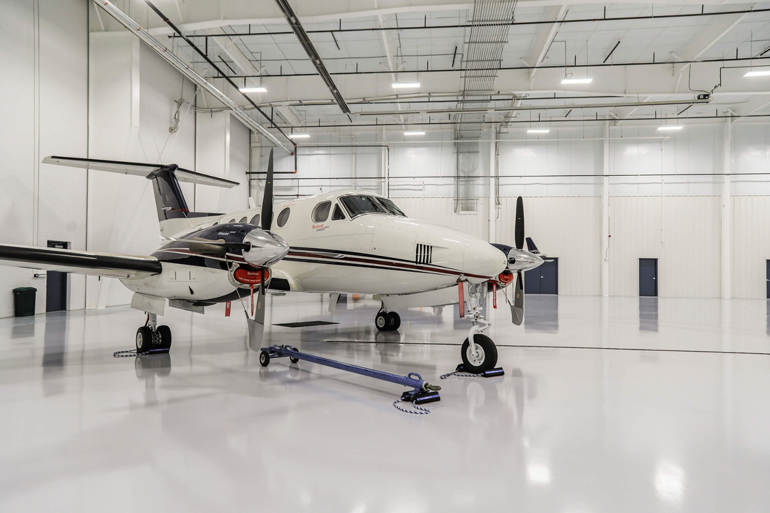 Small plane in white Chantilly Air Hangar.