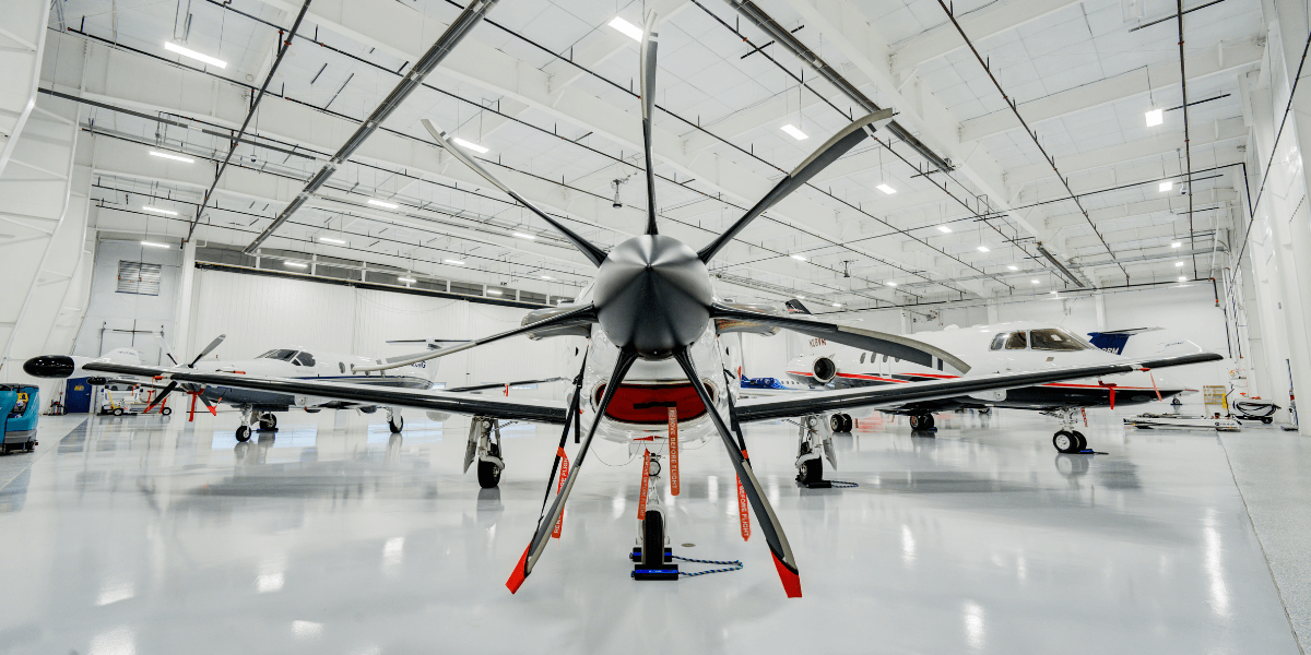 private airplane inside of Chantilly Air's hangar