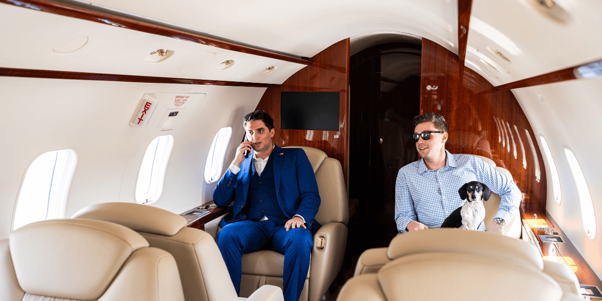 two Chantilly Air guests inside one of our private charter challengers