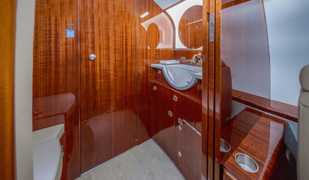 Inside Chantilly Air's Challenger 300 aircraft showing the spacious sink and private bathroom