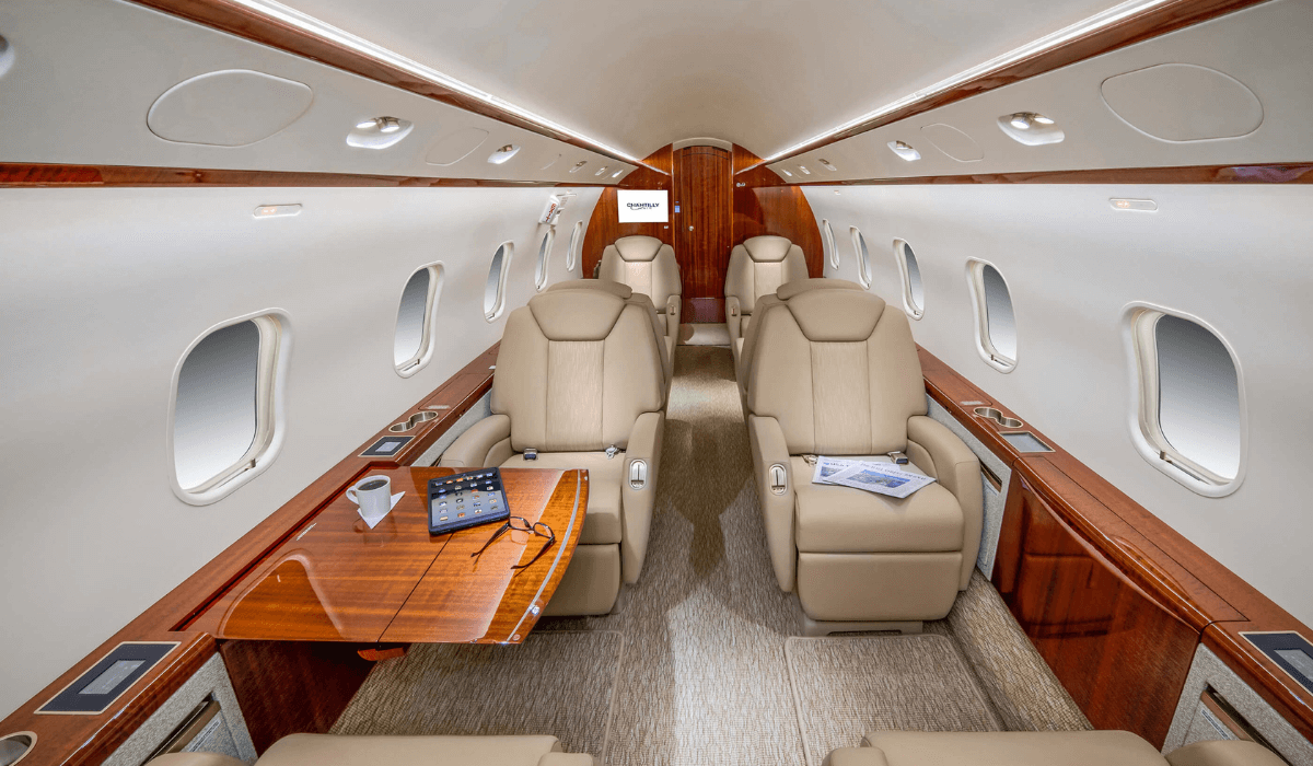 Inside Chantilly Air's Challenger 300 aircraft with 8 seats shown and a pullout working table