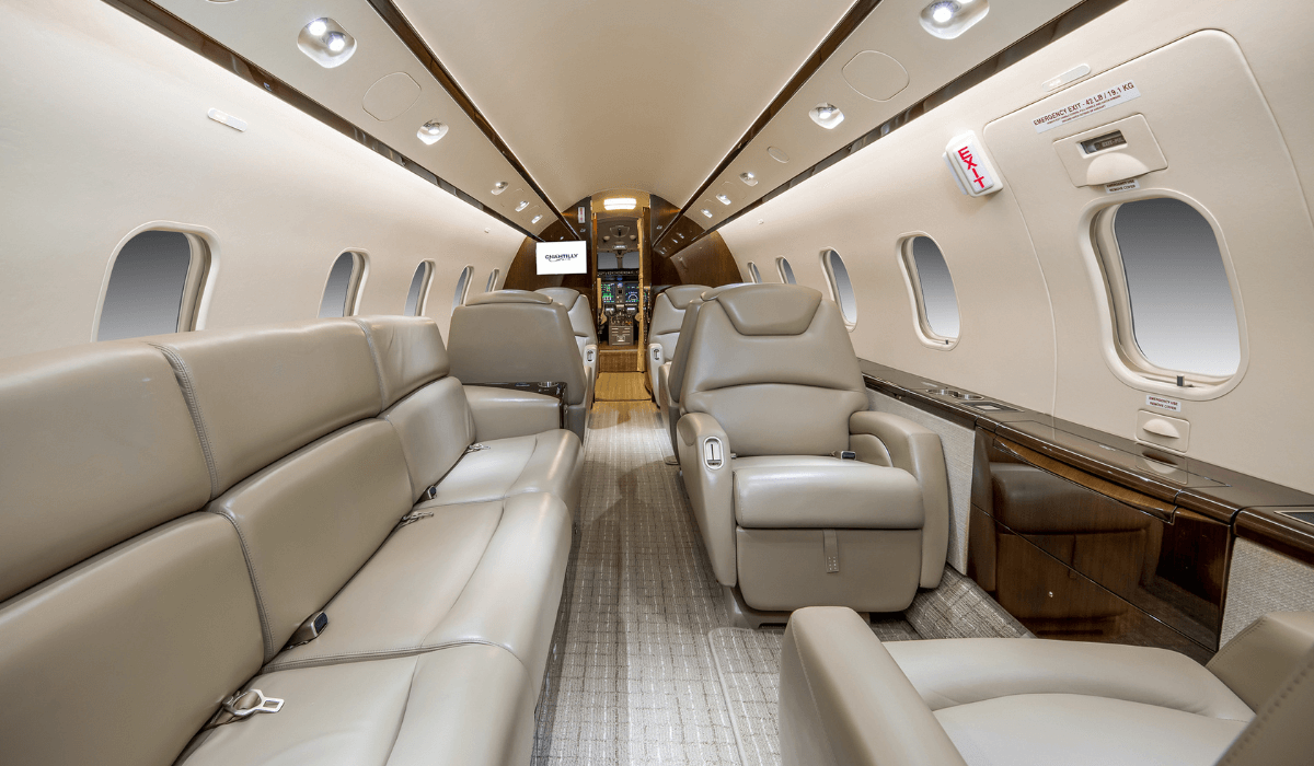 Inside Chantilly Air's Challenger 300 aircraft showing 6 seats and a sofa