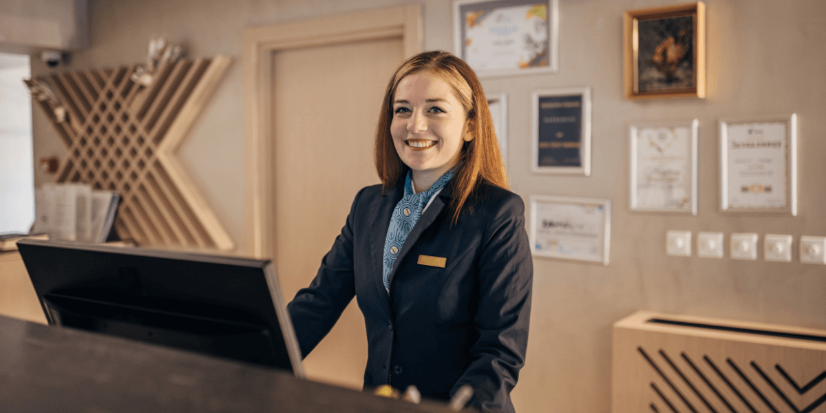 Front desk woman at hotel.