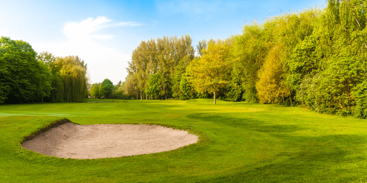 Golf course with sand pit.