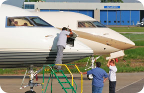 Man performing maintenance on aircraft